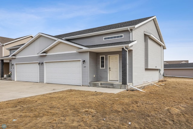 1347 13th St W, West Fargo, ND 58078 - view of front of house featuring concrete driveway and a garage