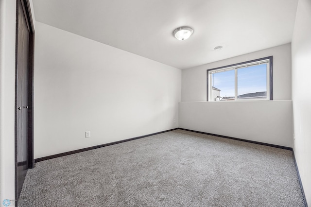 1347 13th St W, West Fargo, ND 58078 - unfurnished room featuring carpet floors and baseboards