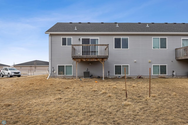 1347 13th St W, West Fargo, ND 58078 - back of house featuring central AC unit and a yard