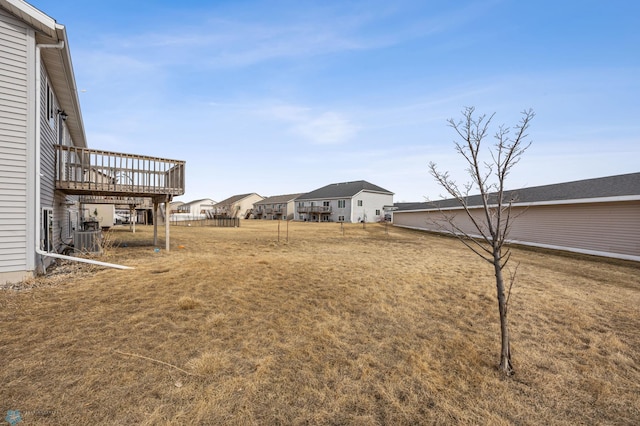 1347 13th St W, West Fargo, ND 58078 - view of yard with a wooden deck and central air condition unit