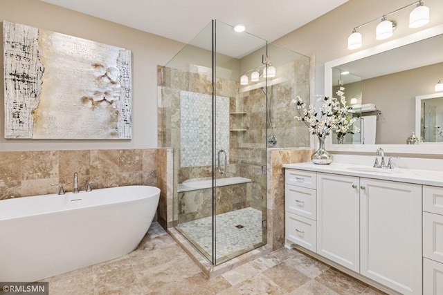 4110 Osprey Ct NE, Prior Lake, MN 55372 - full bath featuring a freestanding tub, vanity, a shower stall, and tile walls