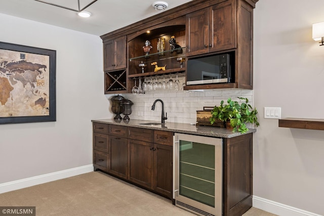 4110 Osprey Ct NE, Prior Lake, MN 55372 - indoor wet bar with beverage cooler, black microwave, tasteful backsplash, baseboards, and light colored carpet