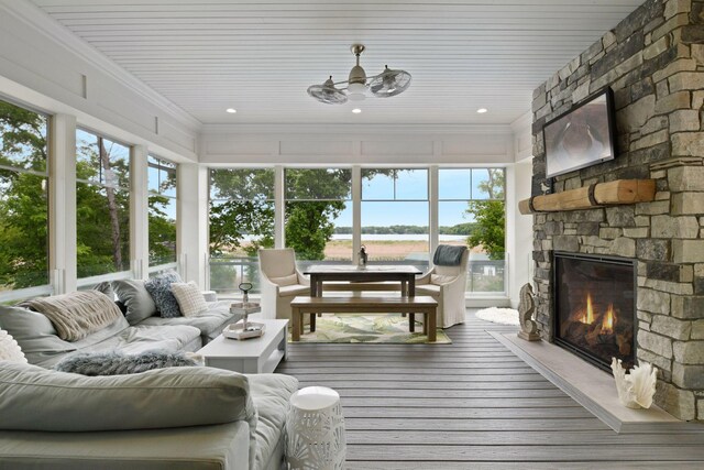 3758 Woodland Cove Pkwy, Minnetrista, MN 55331 - sunroom featuring healthy amount of natural light, wood-type flooring, and crown molding
