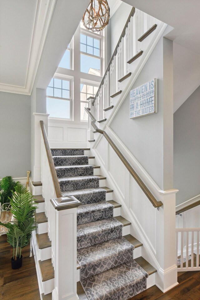 3758 Woodland Cove Pkwy, Minnetrista, MN 55331 - stairway with wood finished floors, a chandelier, ornamental molding, and a decorative wall