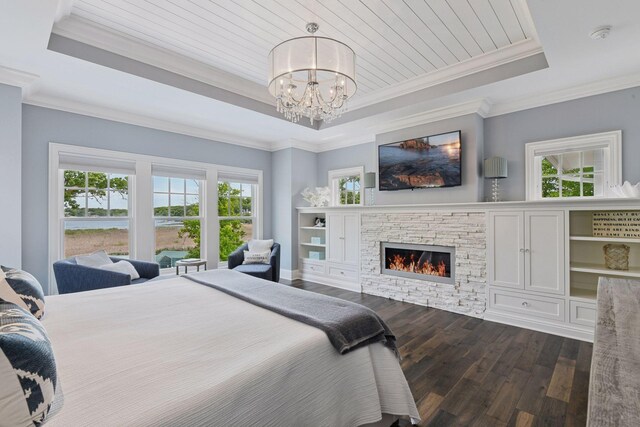 3758 Woodland Cove Pkwy, Minnetrista, MN 55331 - bedroom featuring a raised ceiling, dark wood-style flooring, a stone fireplace, and ornamental molding