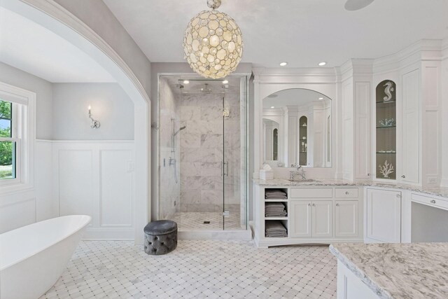 3758 Woodland Cove Pkwy, Minnetrista, MN 55331 - full bathroom with a stall shower, vanity, tile patterned floors, a freestanding tub, and wainscoting