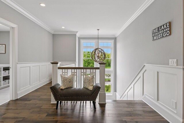 3758 Woodland Cove Pkwy, Minnetrista, MN 55331 - living area with a decorative wall, ornamental molding, an upstairs landing, dark wood finished floors, and a wainscoted wall