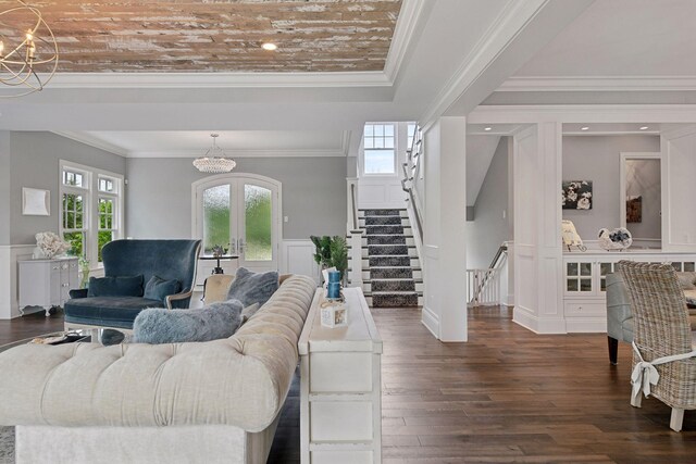 3758 Woodland Cove Pkwy, Minnetrista, MN 55331 - living room with a chandelier, french doors, stairs, dark wood-style floors, and crown molding
