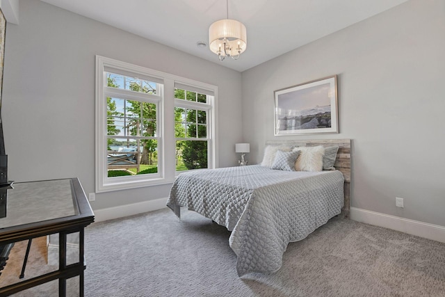 3758 Woodland Cove Pkwy, Minnetrista, MN 55331 - carpeted bedroom with a chandelier and baseboards