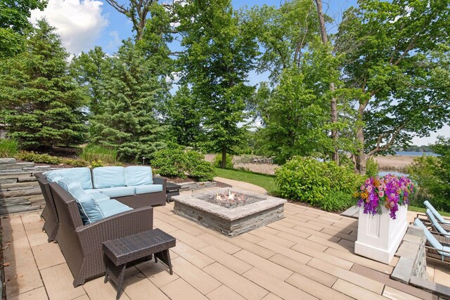 3758 Woodland Cove Pkwy, Minnetrista, MN 55331 - view of patio featuring an outdoor living space with a fire pit