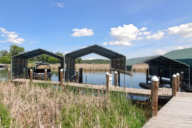 3758 Woodland Cove Pkwy, Minnetrista, MN 55331 - dock area featuring a water view and boat lift