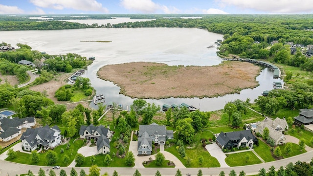 3758 Woodland Cove Pkwy, Minnetrista, MN 55331 - aerial view of residential area with a large body of water and a heavily wooded area