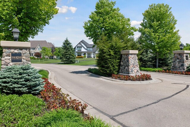3758 Woodland Cove Pkwy, Minnetrista, MN 55331 - view of asphalt road featuring curbs