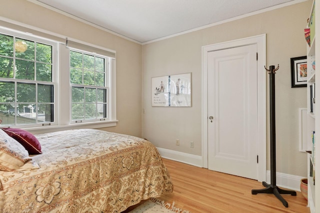 2248 Goodrich Ave, Saint Paul, MN 55105 - bedroom featuring light wood-type flooring, baseboards, and crown molding