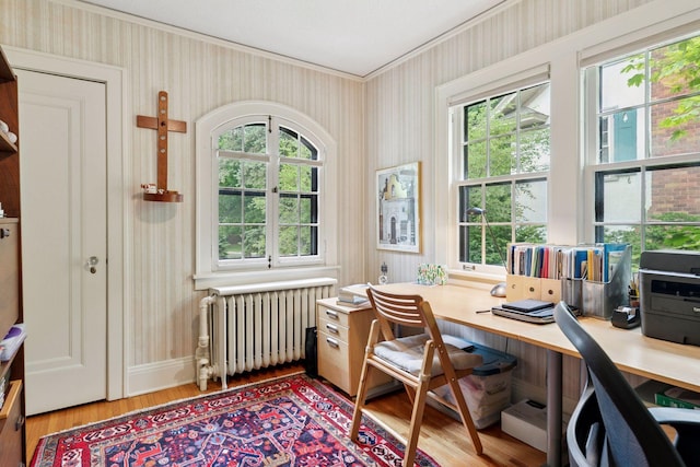 2248 Goodrich Ave, Saint Paul, MN 55105 - home office with radiator, wood finished floors, crown molding, wallpapered walls, and plenty of natural light