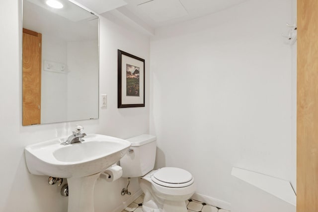 2248 Goodrich Ave, Saint Paul, MN 55105 - bathroom with toilet, baseboards, and tile patterned floors