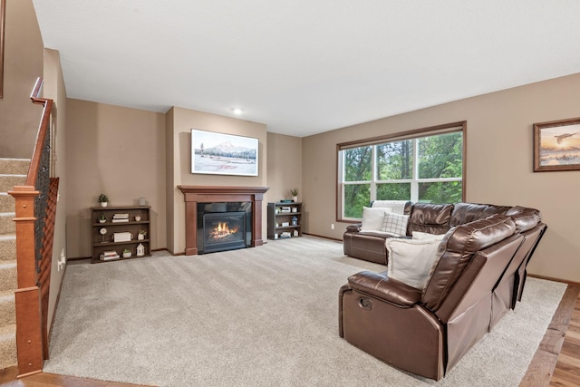 4027 148th Ln NE, Ham Lake, MN 55304 - living room featuring stairs and a glass covered fireplace