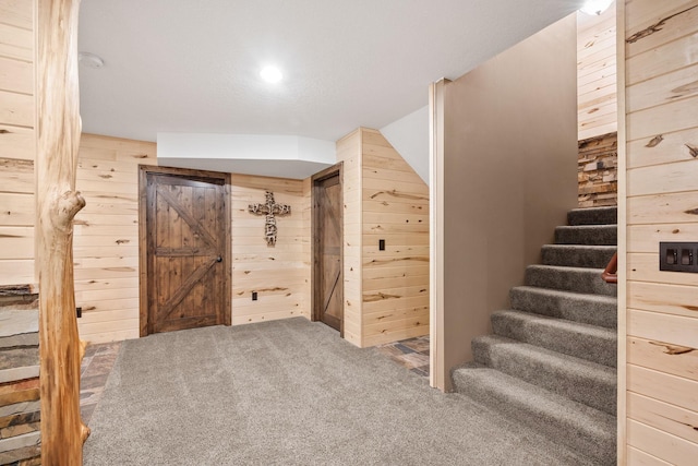 4027 148th Ln NE, Ham Lake, MN 55304 - staircase featuring wood walls and carpet flooring
