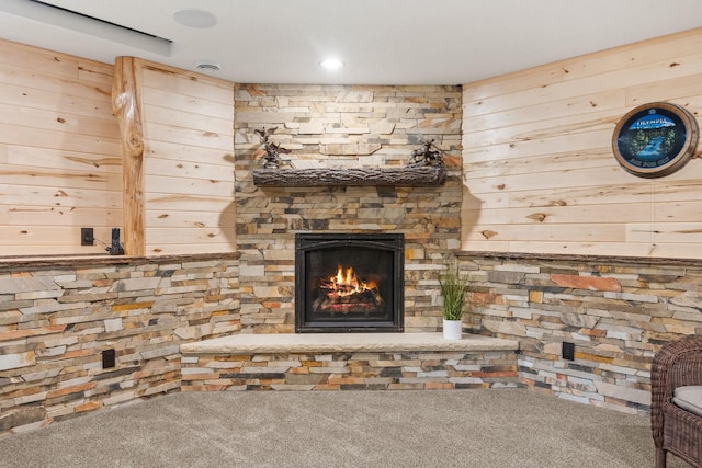 4027 148th Ln NE, Ham Lake, MN 55304 - detailed view of carpet flooring, wood walls, and a stone fireplace