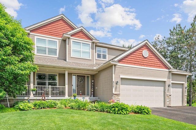 4027 148th Ln NE, Ham Lake, MN 55304 - craftsman inspired home featuring a garage, driveway, covered porch, and a front yard