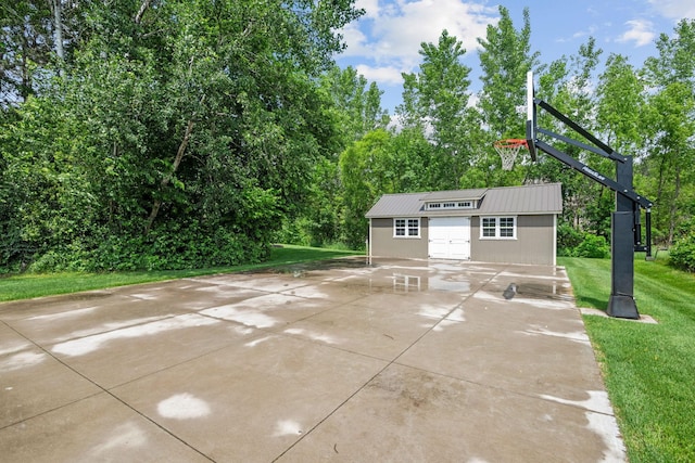 4027 148th Ln NE, Ham Lake, MN 55304 - view of patio with an outbuilding and view of scattered trees