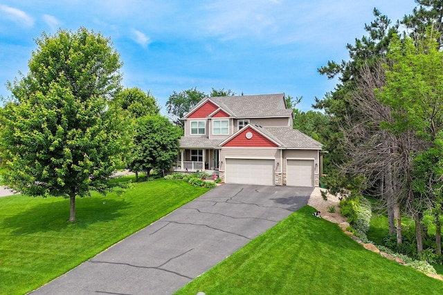 4027 148th Ln NE, Ham Lake, MN 55304 - craftsman-style house with driveway, a front lawn, an attached garage, stone siding, and a porch