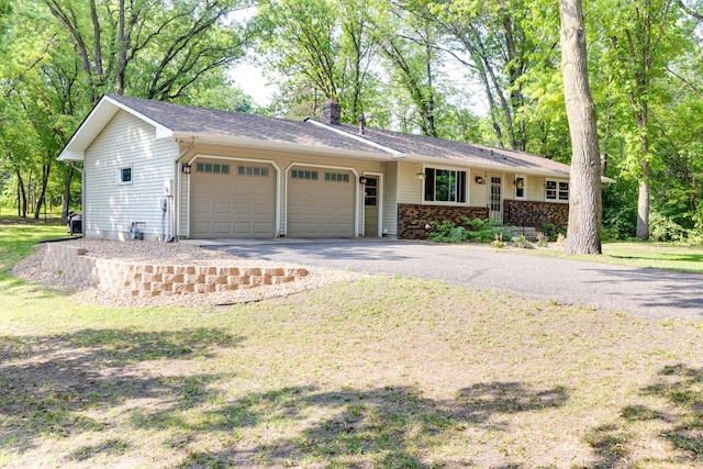 13500 190th Ave NW, Elk River, MN 55330 - single story home featuring a garage, driveway, a chimney, and brick siding