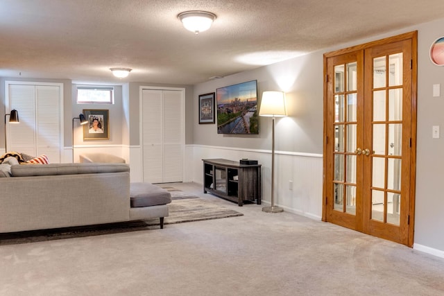 13500 190th Ave NW, Elk River, MN 55330 - carpeted living area featuring french doors and a textured ceiling