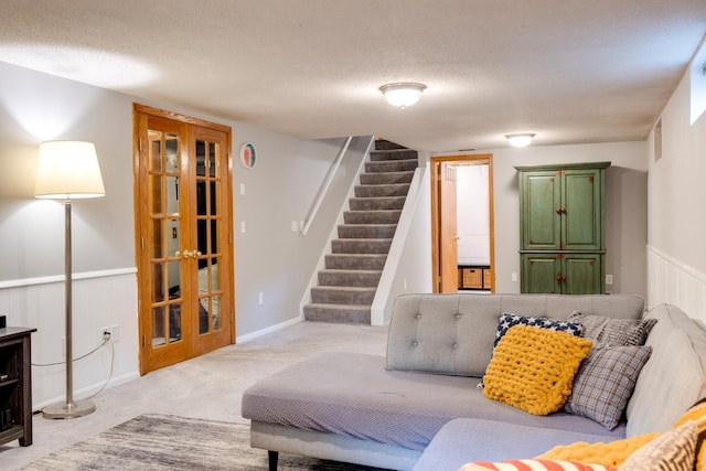 13500 190th Ave NW, Elk River, MN 55330 - carpeted living room featuring stairway, a textured ceiling, and french doors