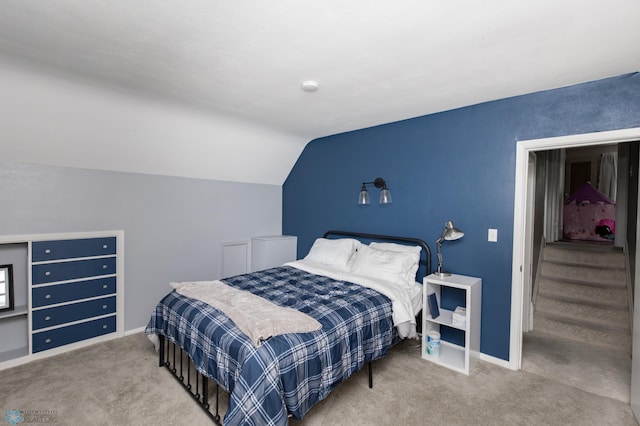 1345 4th St N, Fargo, ND 58102 - carpeted bedroom featuring vaulted ceiling and baseboards