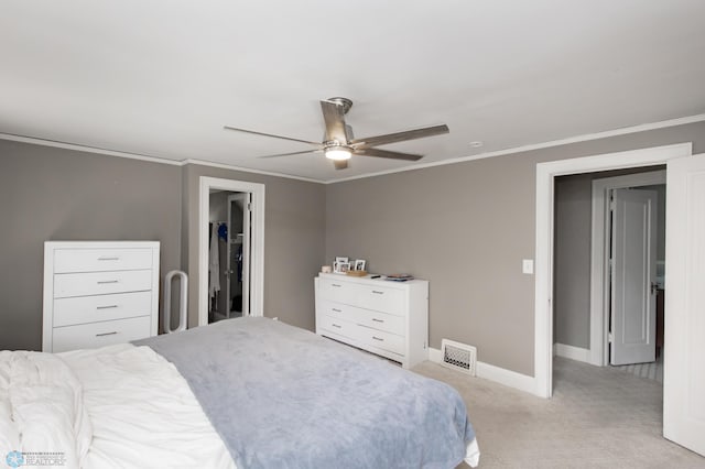 1345 4th St N, Fargo, ND 58102 - bedroom featuring light colored carpet, baseboards, ornamental molding, and a ceiling fan