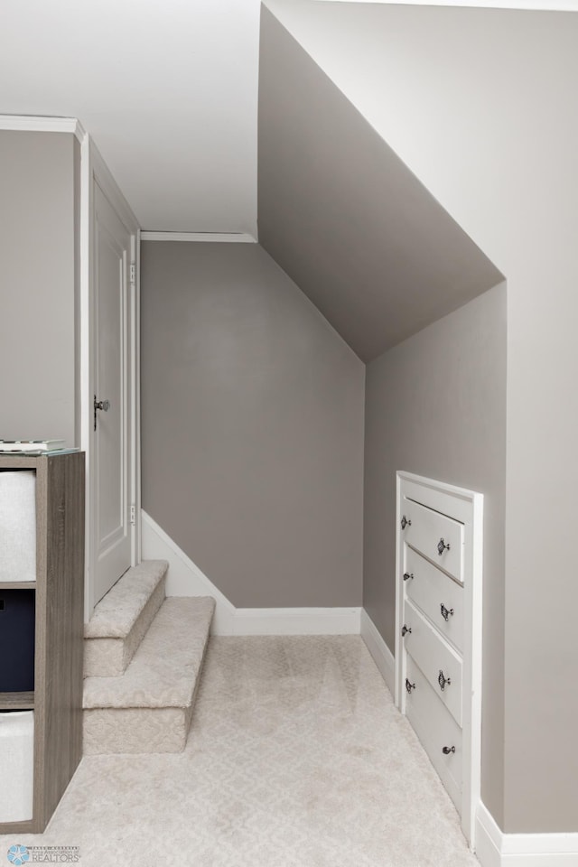 1345 4th St N, Fargo, ND 58102 - stairway featuring vaulted ceiling, baseboards, and carpet flooring