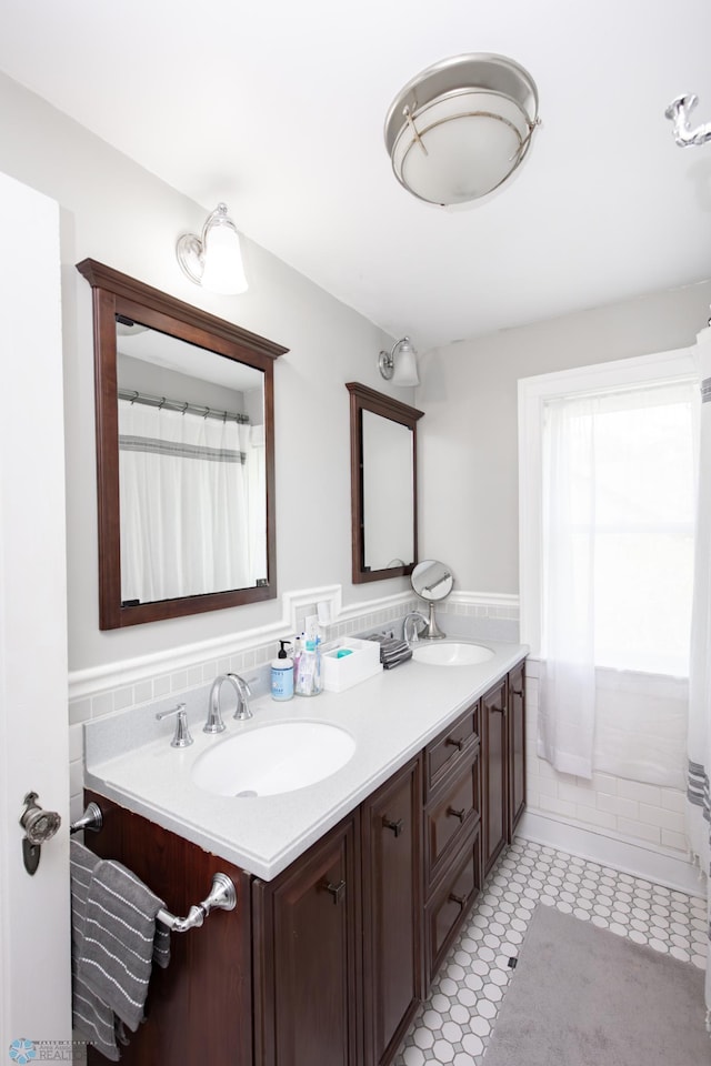 1345 4th St N, Fargo, ND 58102 - bathroom featuring double vanity and wainscoting