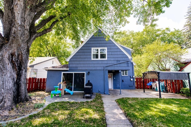 1345 4th St N, Fargo, ND 58102 - back of house featuring a patio area and stucco siding