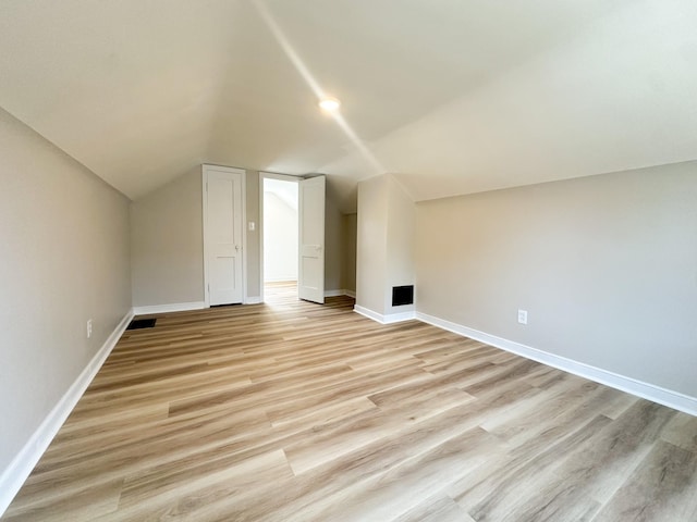 951 13th Ave NE, Rochester, MN 55906 - bonus room featuring vaulted ceiling, light wood-type flooring, and baseboards