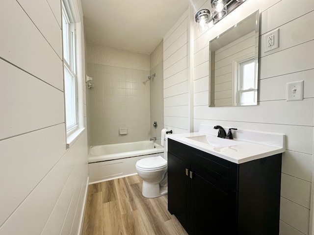 951 13th Ave NE, Rochester, MN 55906 - full bathroom featuring toilet, wood finished floors, vanity, and shower / bath combination