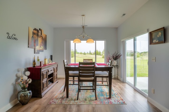1320 Whiting Rd NW Unit 71, Bemidji, MN 56601 - dining area with light wood-type flooring and baseboards