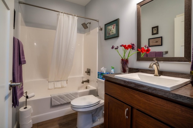 1320 Whiting Rd NW Unit 71, Bemidji, MN 56601 - bathroom featuring vanity, toilet, shower / bath combo with shower curtain, and wood finished floors