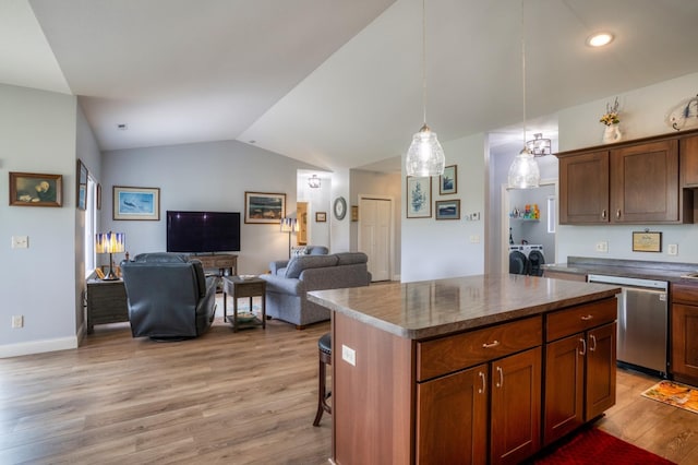 1320 Whiting Rd NW Unit 71, Bemidji, MN 56601 - kitchen featuring dishwasher, separate washer and dryer, light wood-style flooring, lofted ceiling, and a kitchen island