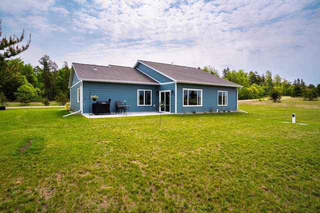 1320 Whiting Rd NW Unit 71, Bemidji, MN 56601 - rear view of property with a patio area, a yard, and a shingled roof