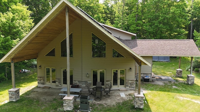 4251 Sugar Pt, Orr, MN 55771 - rear view of house with a yard, a patio area, stone siding, french doors, and roof with shingles