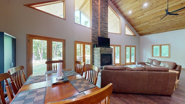4251 Sugar Pt, Orr, MN 55771 - dining space with high vaulted ceiling, wood ceiling, a fireplace, dark wood finished floors, and french doors