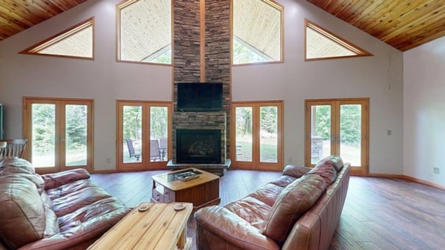 4251 Sugar Pt, Orr, MN 55771 - living room featuring french doors, a fireplace, high vaulted ceiling, wood ceiling, and hardwood / wood-style floors