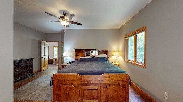 4251 Sugar Pt, Orr, MN 55771 - bedroom featuring baseboards, wood finished floors, and ceiling fan