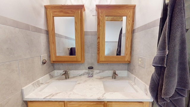 4251 Sugar Pt, Orr, MN 55771 - bathroom featuring tile walls and double vanity