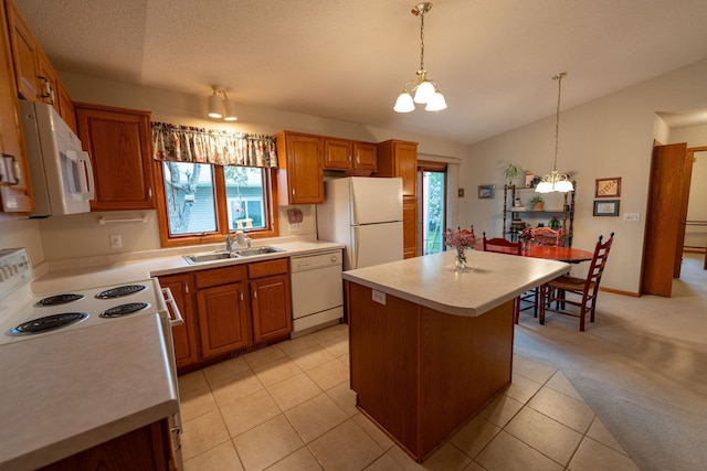 2842 19th Ave NW, Rochester, MN 55901 - kitchen with white appliances, a sink, a chandelier, light countertops, and plenty of natural light