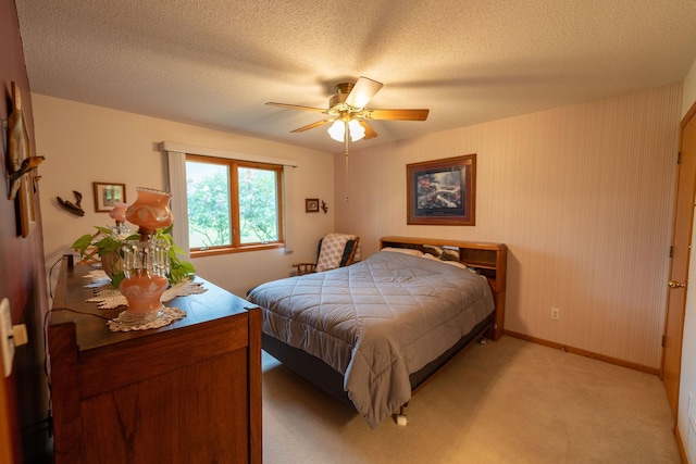 2842 19th Ave NW, Rochester, MN 55901 - bedroom featuring baseboards, a ceiling fan, light colored carpet, and a textured ceiling