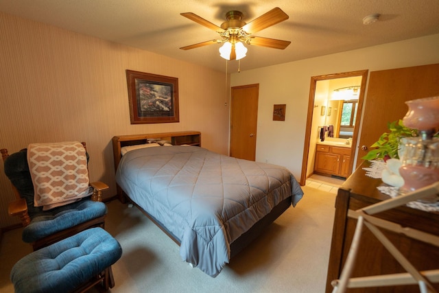 2842 19th Ave NW, Rochester, MN 55901 - bedroom with light carpet, ensuite bathroom, and ceiling fan