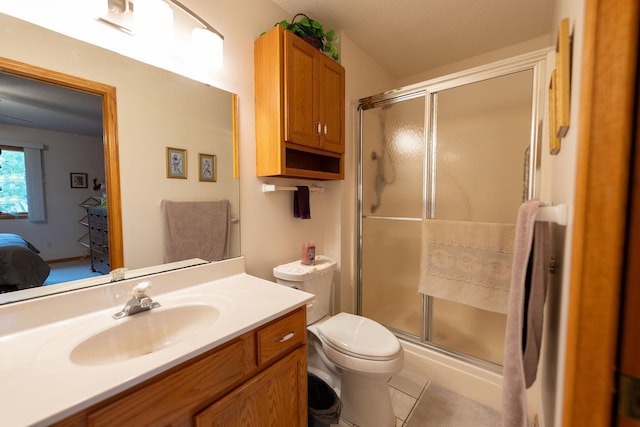 2842 19th Ave NW, Rochester, MN 55901 - ensuite bathroom featuring toilet, a shower stall, vanity, and tile patterned floors