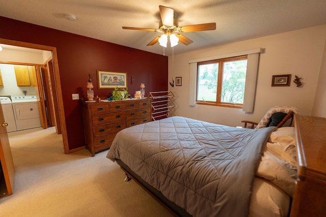 2842 19th Ave NW, Rochester, MN 55901 - bedroom with washing machine and dryer, light colored carpet, and a ceiling fan